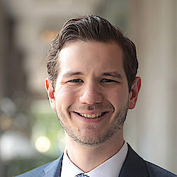 Cropped headshot of Stephen W. Perkins. Stephen is smiling and looking at the camera.