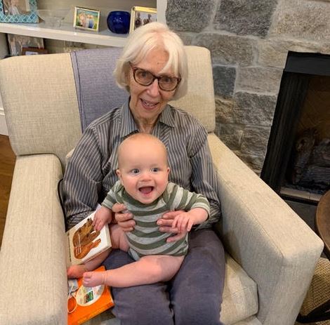 Volunteer Spotlight: Linda Weinstein; Linda holds her infant great grandson, whom she considers her greatest motivation; volunteer spotlight; price on carbon