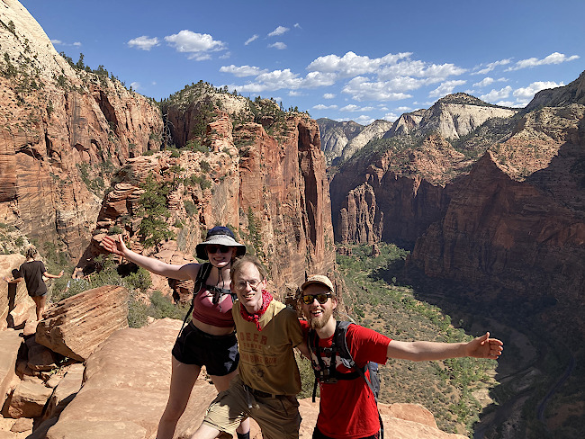 Volunteer Bob Clark Phelps stands with his children after hiking at Angels Landing