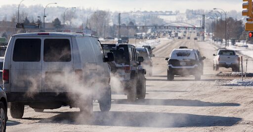 Cars driving and polluting