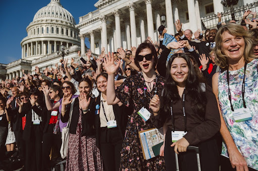 Group of climate change advocates in front of Capitol Hill