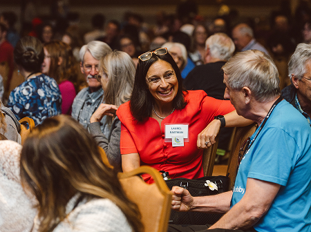 Volunteers talking at the conference