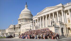 Hundreds of CCL volunteers pose for a group photo on the steps of Capitol Hill