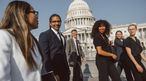 A group of students walk in front of the U.S. capitol