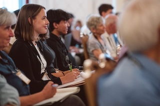 Woman listening to a training at a CCL Conference