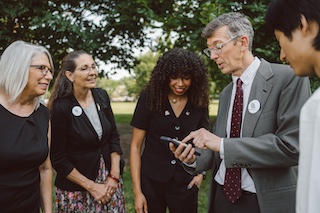 Volunteers taking action on a phone.