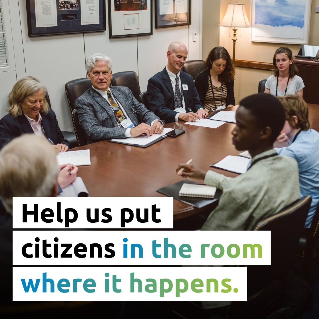Group of CCL volunteers in a lobby meeting with text that reads: Help get citizens in the room where it happens