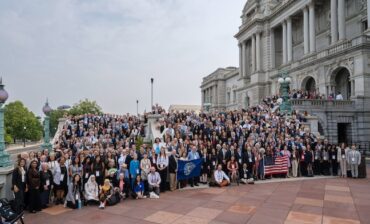 A large group of people gathered on the steps of the Library of Congress.