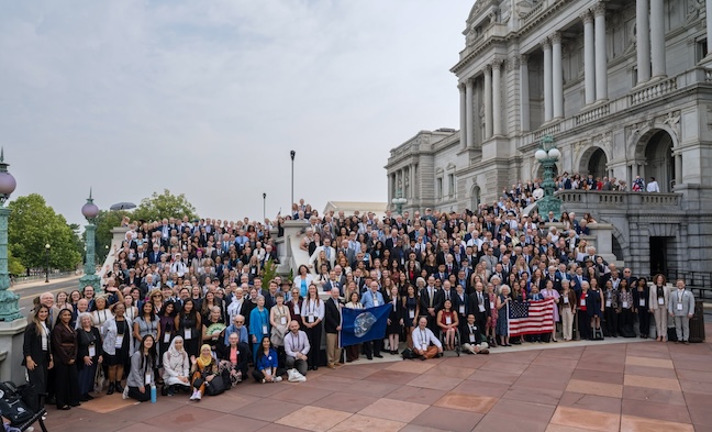 A large group of people gathered on the steps of the Library of Congress.